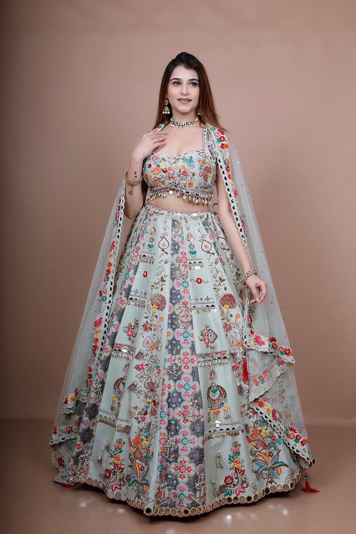 Pista Lehenga Choli in Silk embellished with heavy embroidery