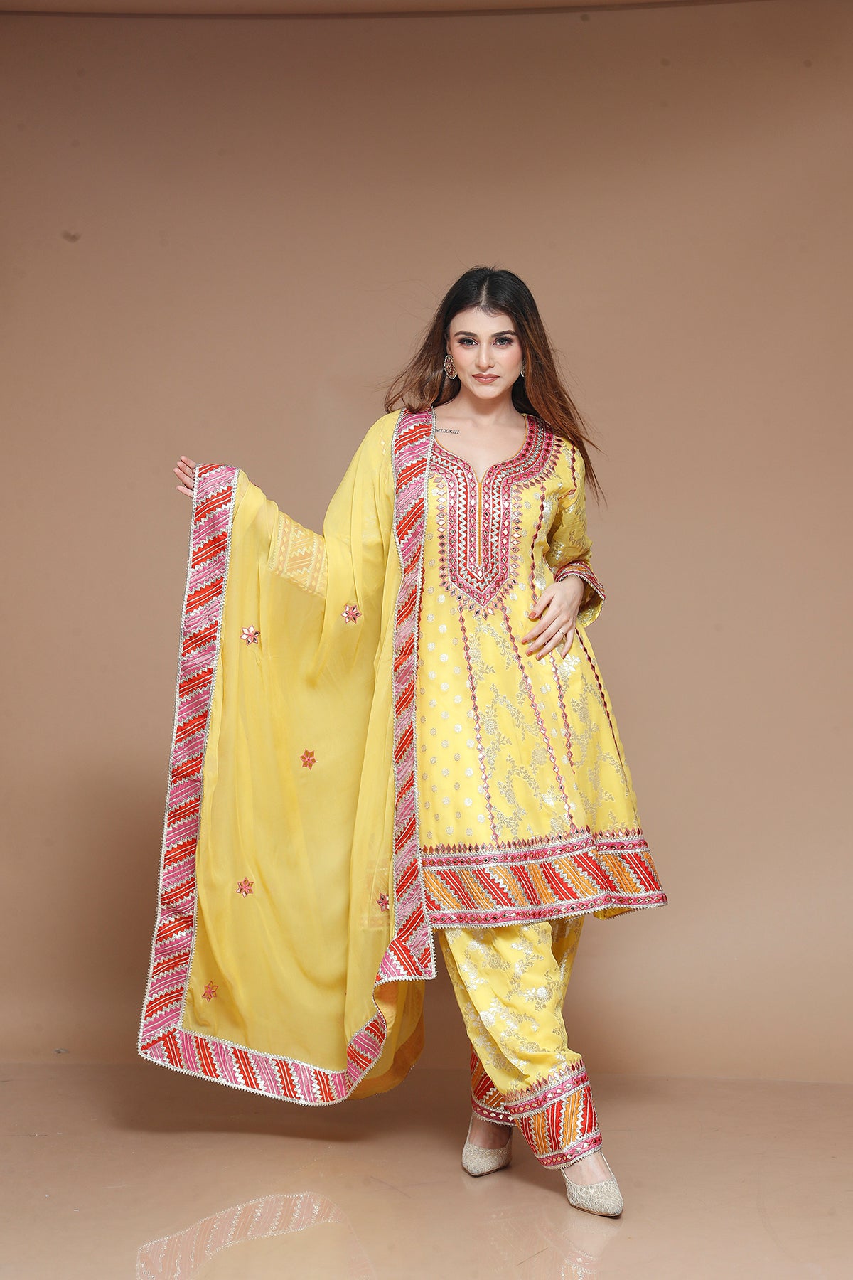 Yellow Banarasi Weaving Salwar Suit adorned with Gotta Patti
