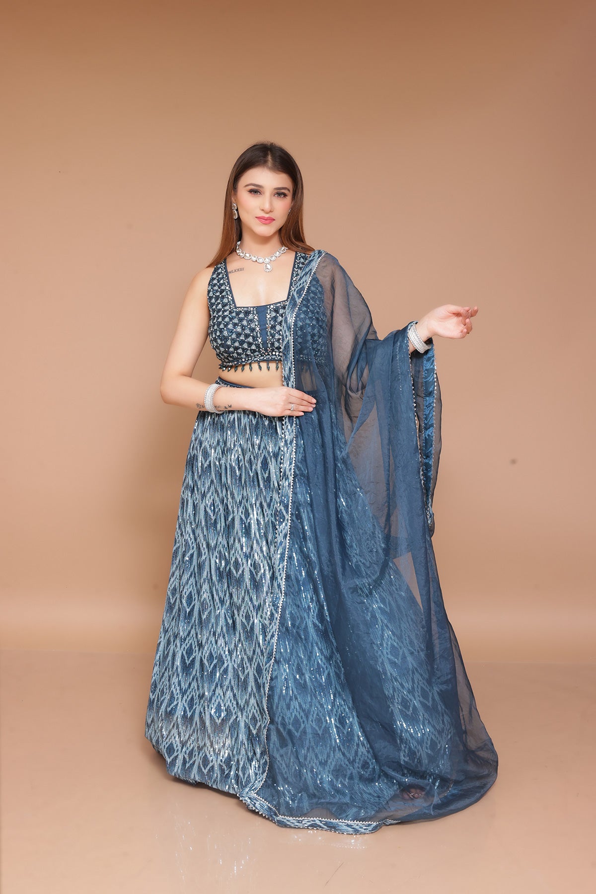 Peacock Lehenga choli in sequin fabric embellished with nalki work