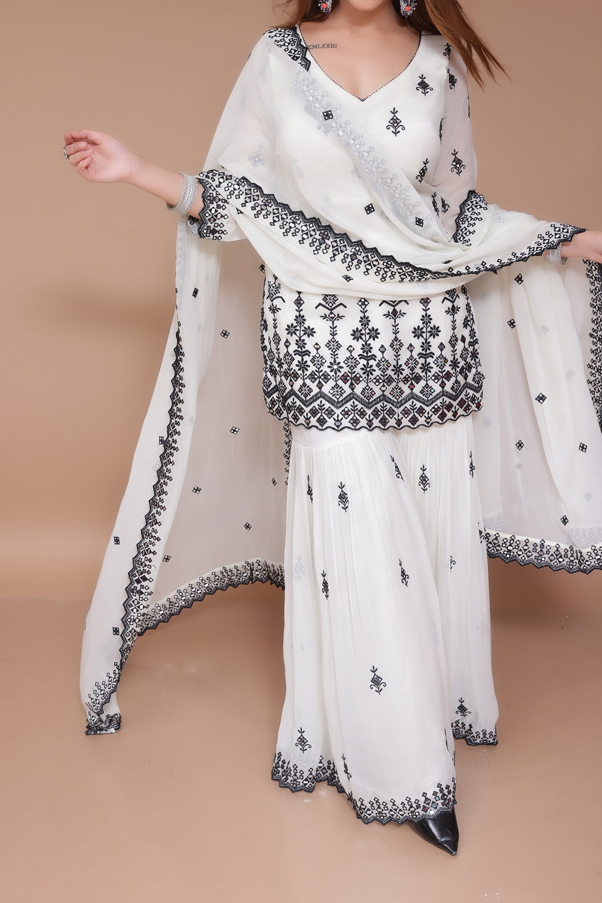 Cream Garara Suit in Georgette embellished with Thread and mirror work