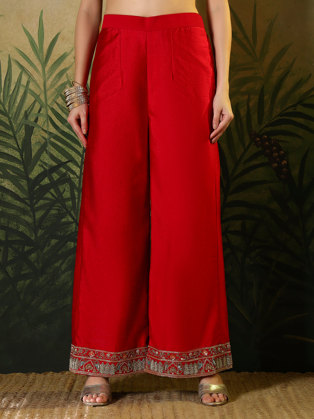 Vibrant red suit, adorned with intricate bird and floral embroidery