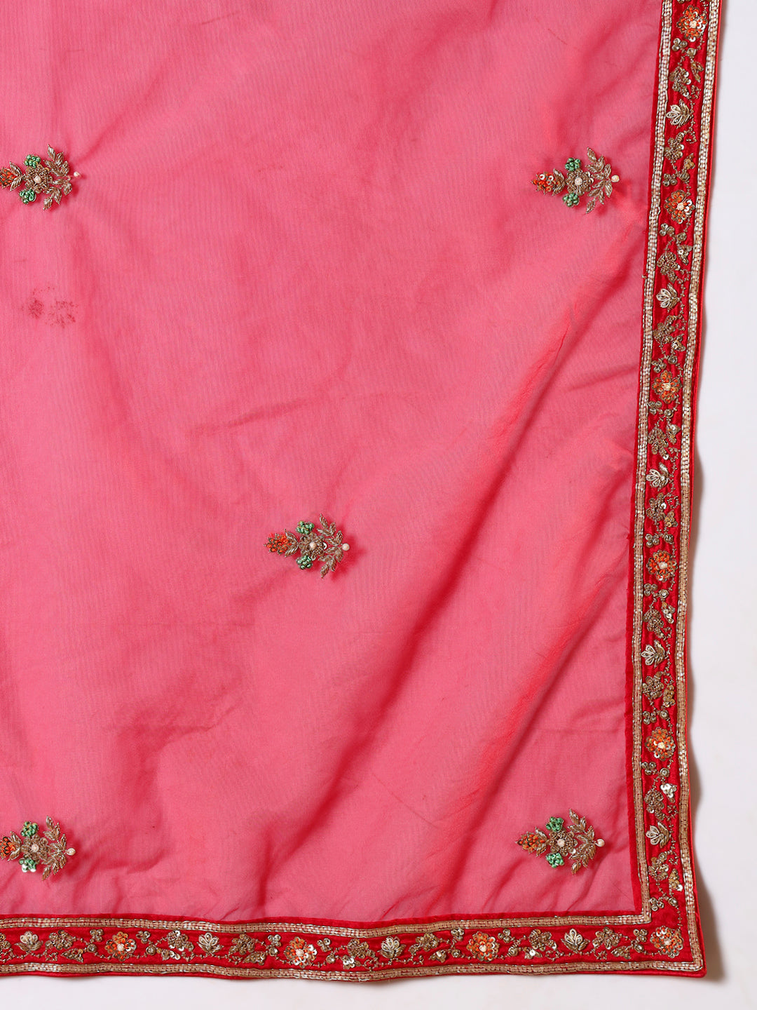 Vibrant red suit, adorned with intricate bird and floral embroidery